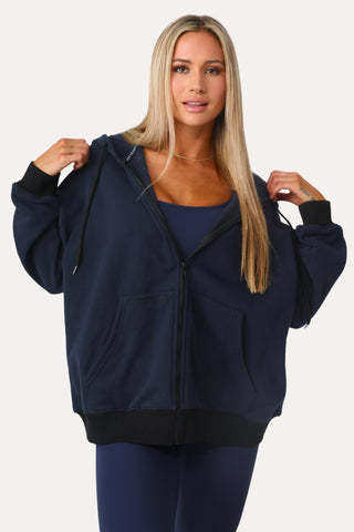 Model wearing the Baller Navy blue + black full zip.