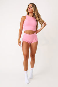 Model wearing the Bubble Gum Pink basics full coverage tank