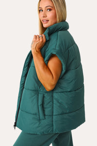 Model wearing the Teal Puffer Vest.