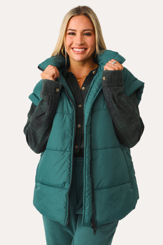 Model wearing the Teal Puffer Vest.