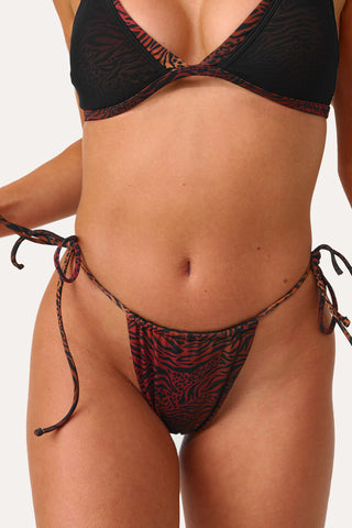 Model wearing the Island Animal Side Tie Bikini Bottom.