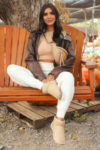 Model wearing Cream Fuzzy Joggers.
