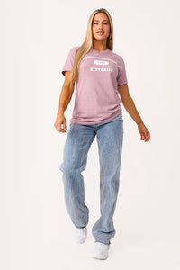 Model wearing Kittenish Logo Graphic Tee in Mauve.