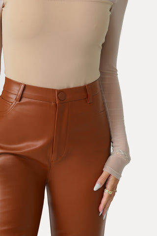 MODEL WEARING SPICE SPICE BABY FAUX LEATHER PANT.