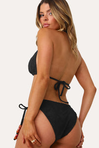 Model wearing the Lucia Beaded Side Tie Bikini Bottom.
