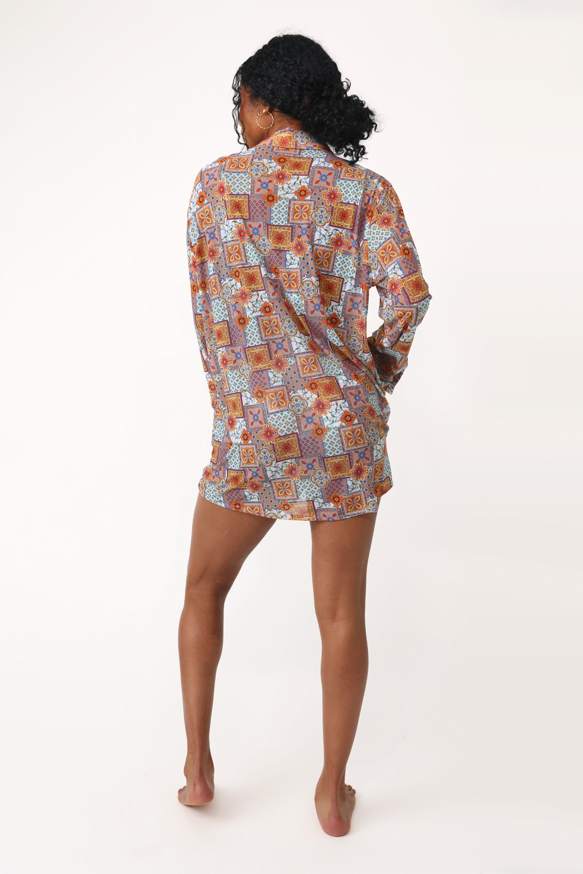 Model wearing the Maria Mesh Button Down printed coverup.