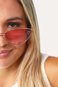Model wearing The Vivianne pink cat eye sunglasses.