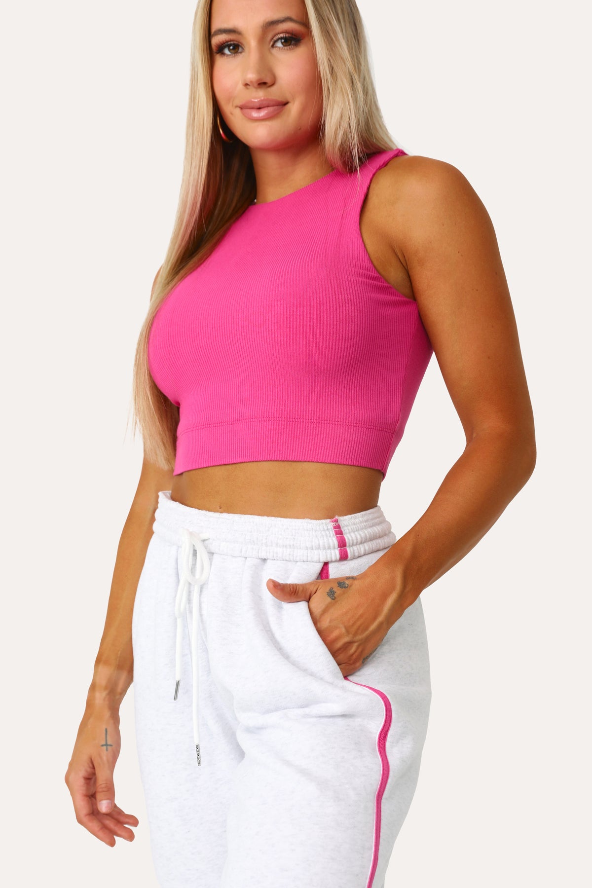 Model wearing the Low Key raspberry basics tank.