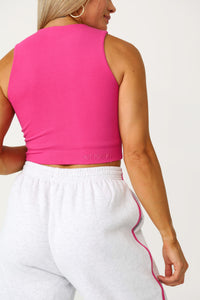 Model wearing the Low Key raspberry basics tank.
