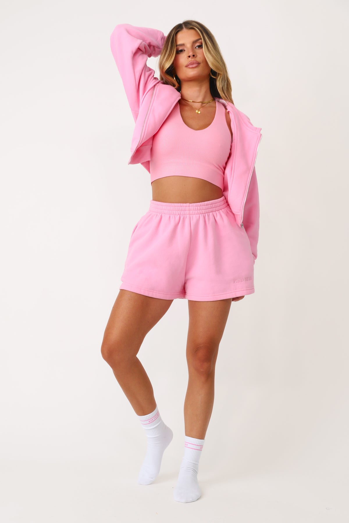 Model wearing the Bubble Gum Pink Kittenish Embroidered sweat short.
