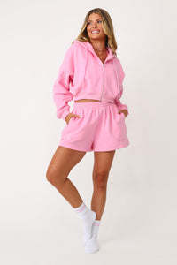 Model wearing the Bubble Gum Pink Kittenish Embroidered sweat short.