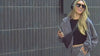 Model on camera walking around a downtown setting, in playful cozy sets. For color ways are featured: Butter Yellow, Charcoal Gray, Light Pink, and White. 