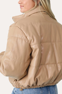 MODEL WEARING HIT THE SLOPES LIGHT TAN FAUX LEATHER PUFFER