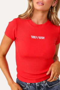 Model wearing the Don't Know, Don't Care red baby tee.