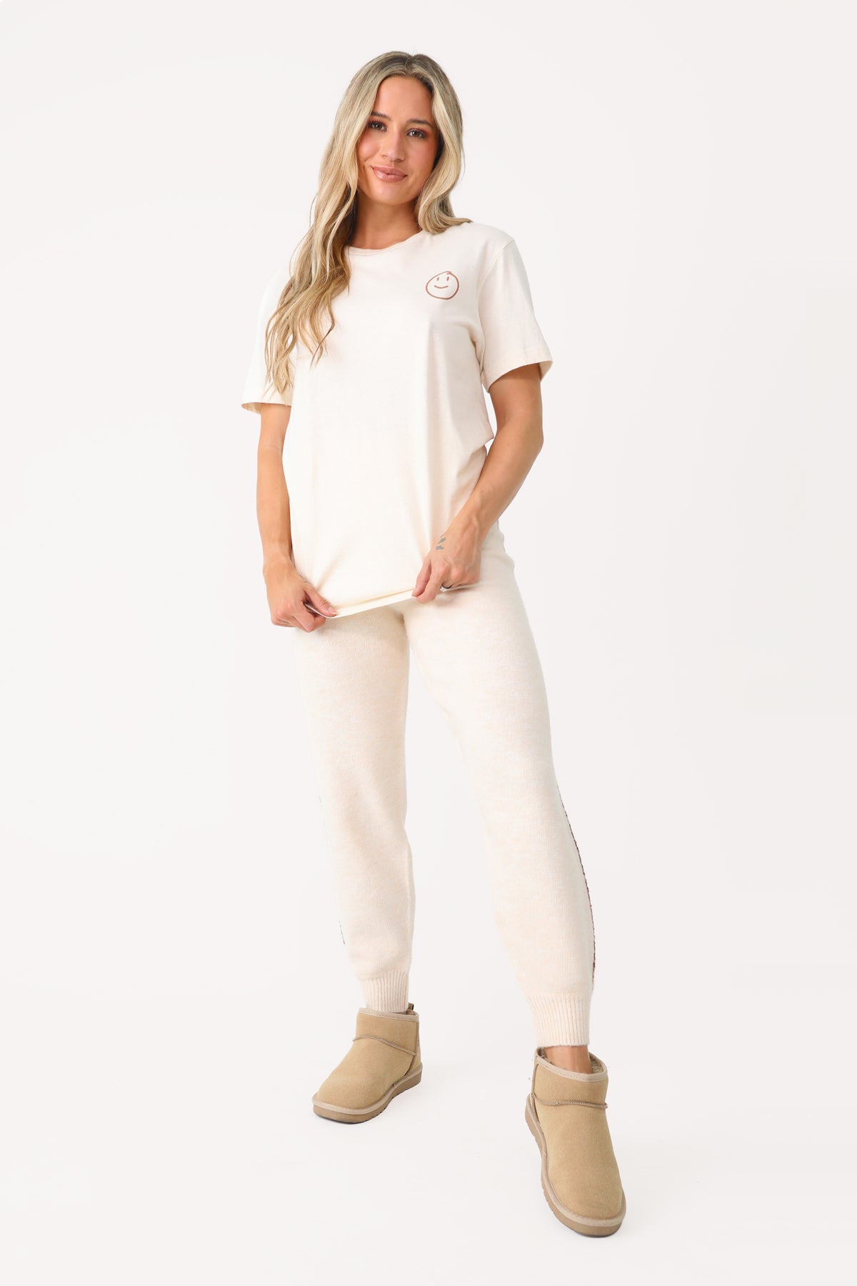 Model wearing Cream Fuzzy Joggers.