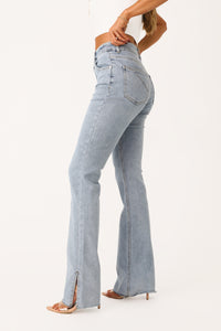 Model wearing 'Aniston' Straight Leg Denim Pant with Slit.