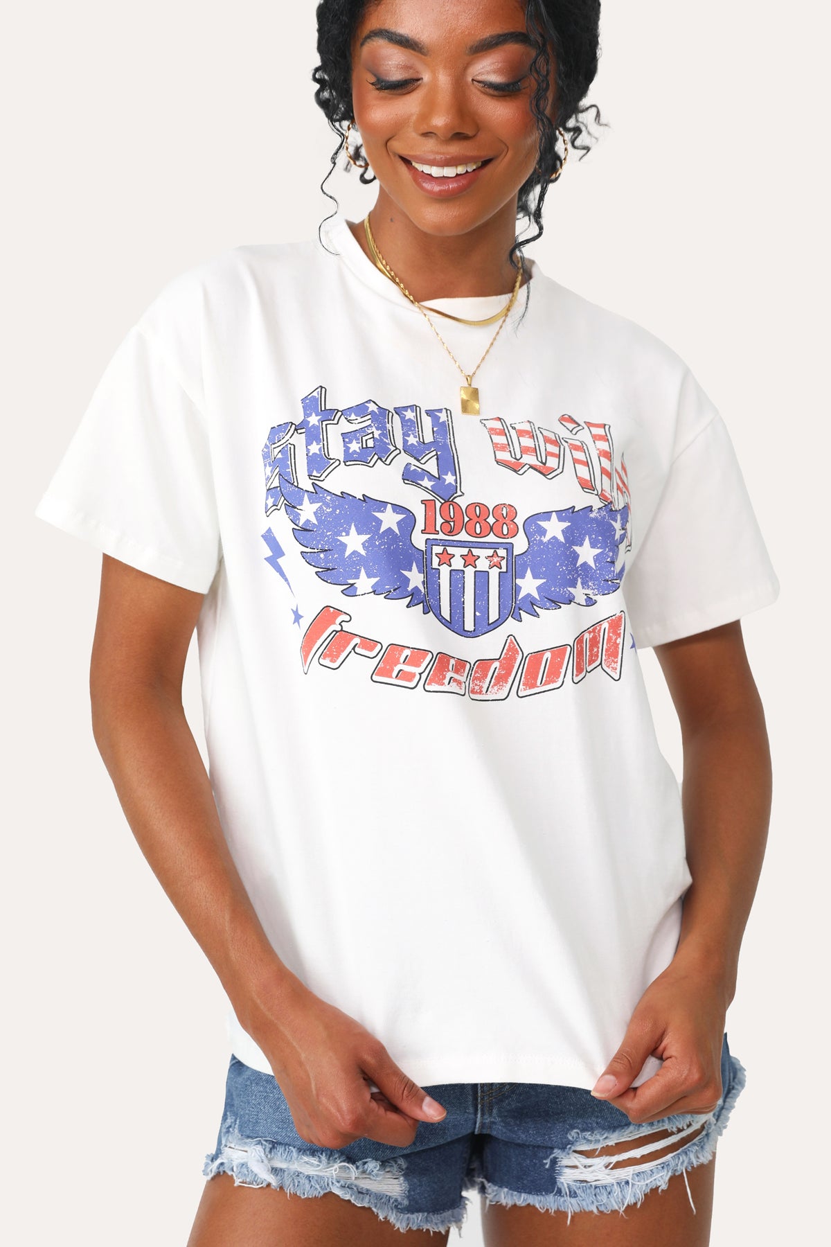 Model wearing the Stay Wild graphic tee.
