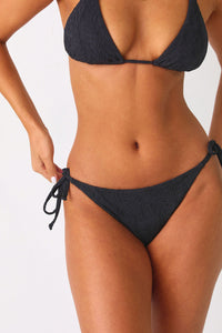 Model wearing the Sweet Escape bikini bottom with matching top.