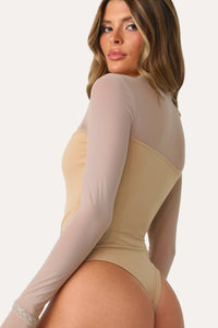 MODEL WEARING OUT ON THE TOWN TAN BODYSUIT.