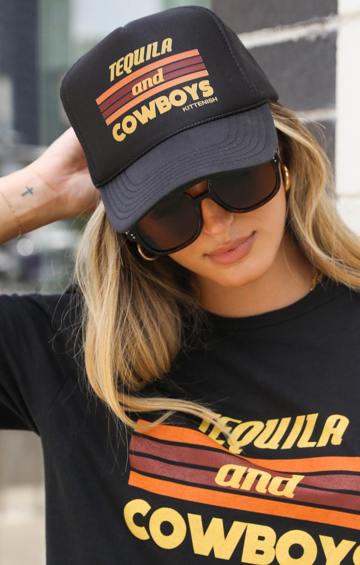 Model wearing the Tequila and Cowboys trucker hat.
