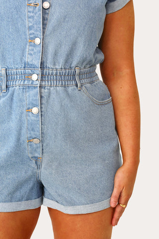 Model wearing the American Woman Denim romper.