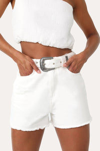 Model wearing the Born Free White belted Denim shorts.
