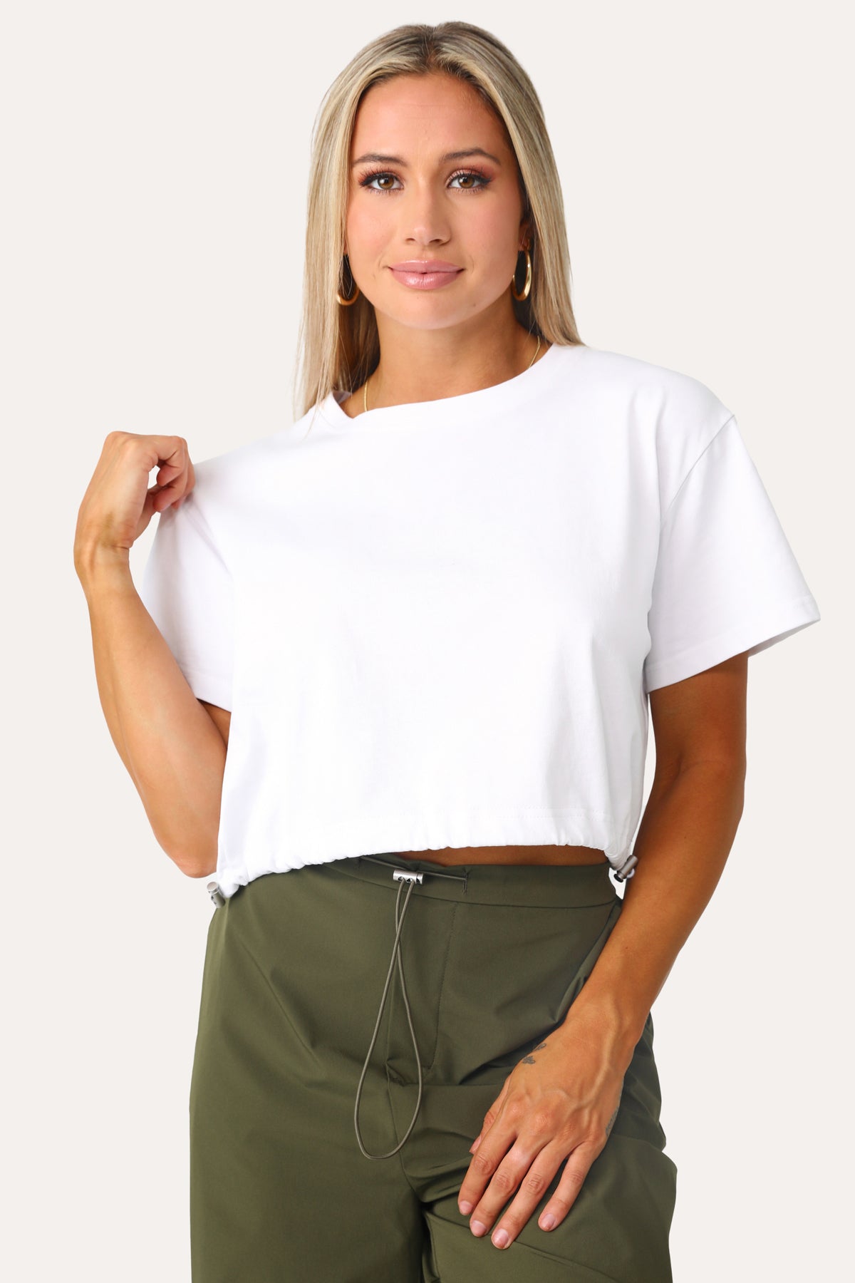 Model wearing the Rookie Crop Shirt with bungees.
