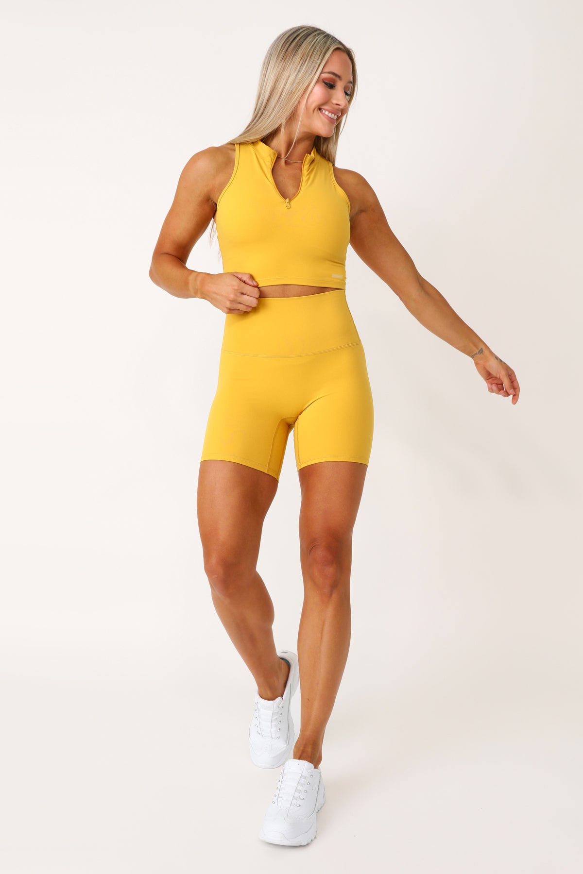 Model wearing the All Star Active yellow shorts.