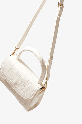 White Micro Purse, front angle with strap.