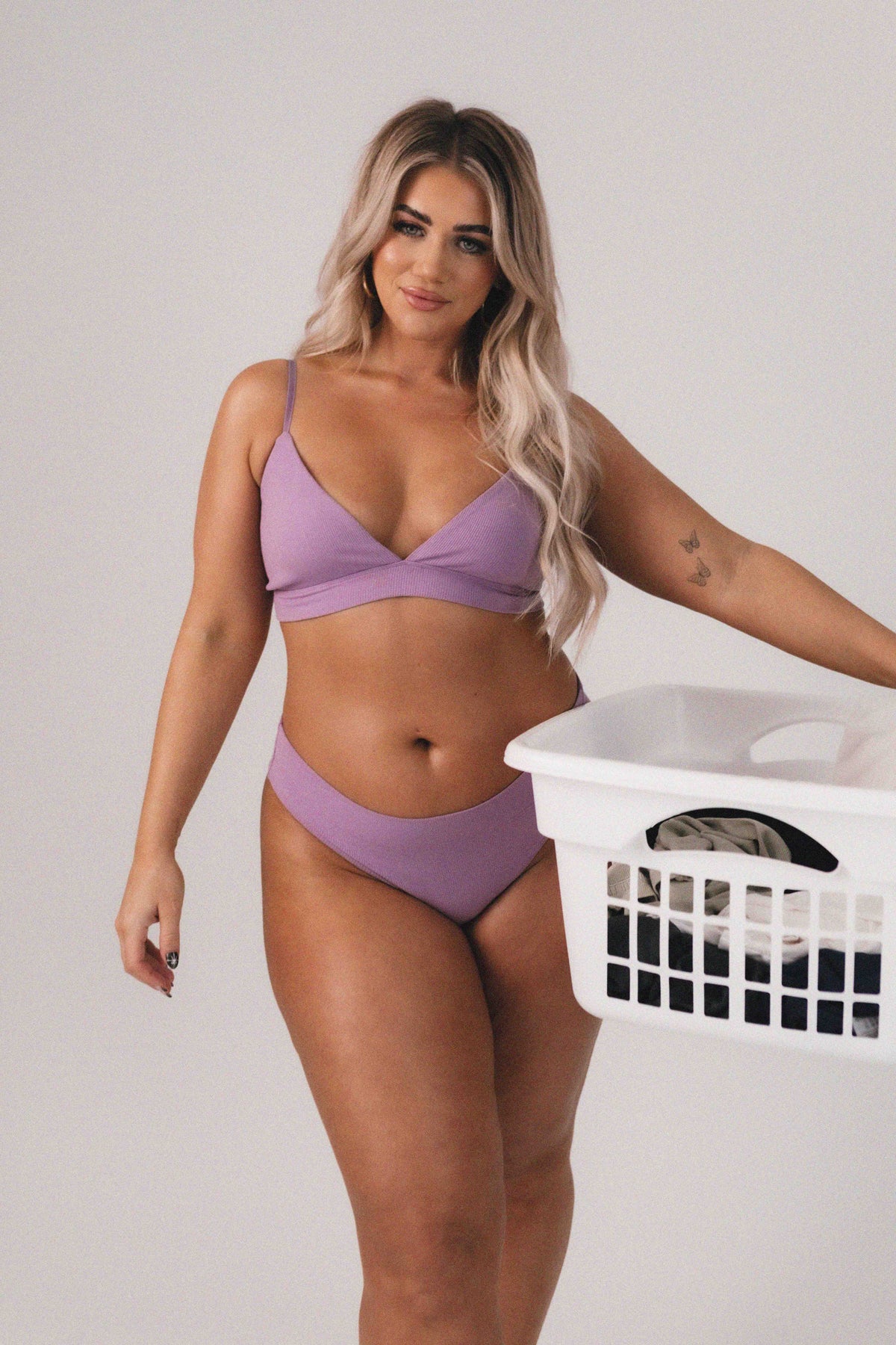 Model wearing Lilac Ribbed Triangle Bralette, seamless rib fabrication with stretch.