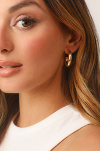 Model wearing 14K Gold Dipped Thin Hoop Earring