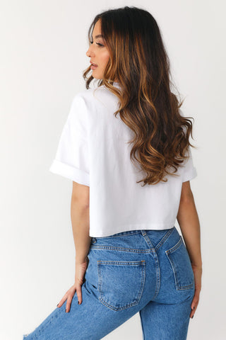 Back view: Model showcasing white oversized, crop tee with Red Block featuring "1988" on the front.