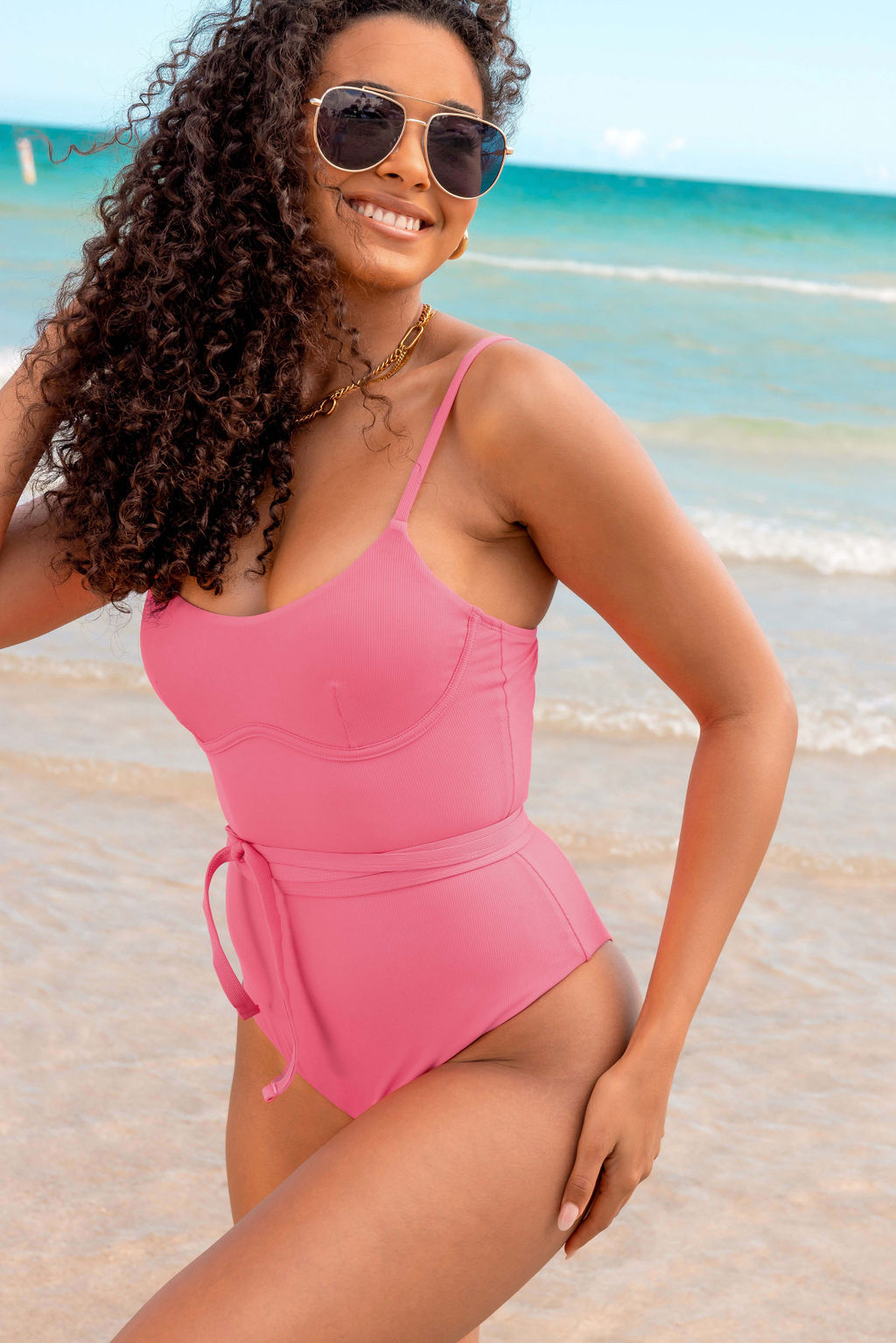 Full body front view of model wearing the Candi One Piece with removable waist tie. 
