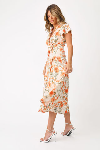 Full body front/side view of model wearing the Tuscan Sun Maxi Dress.