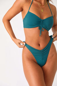 Model wearing On the Rocks Cinch front bikini bottom.